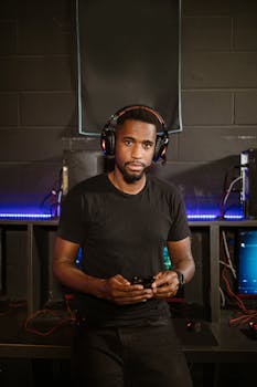 A focused gamer in a modern setup, wearing headphones, immersed in esports.