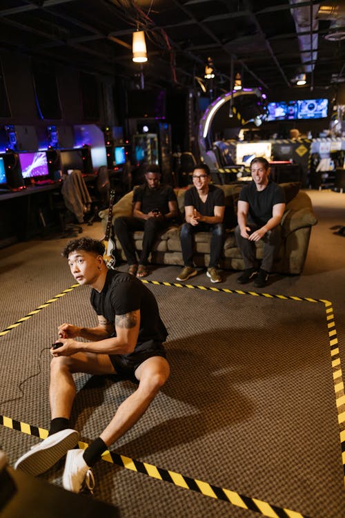 Man in Black Shirt Playing Video Game