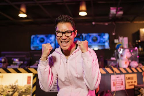 Free Man in Pink Jacket Looking Excited Stock Photo