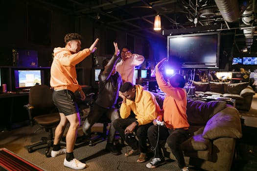 A joyful group of friends celebrating victory in a video game in an indoor gaming lounge.