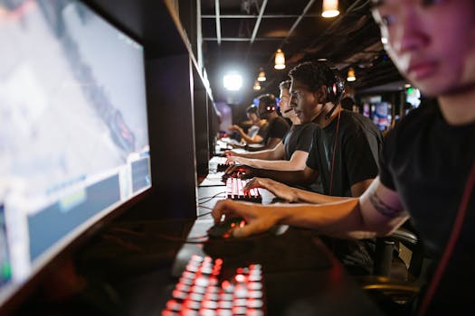 A group of men intensely focused on playing an online game at a gaming arcade.
