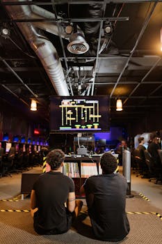 Gamers engaging in a lively playing session at a modern gaming arcade.
