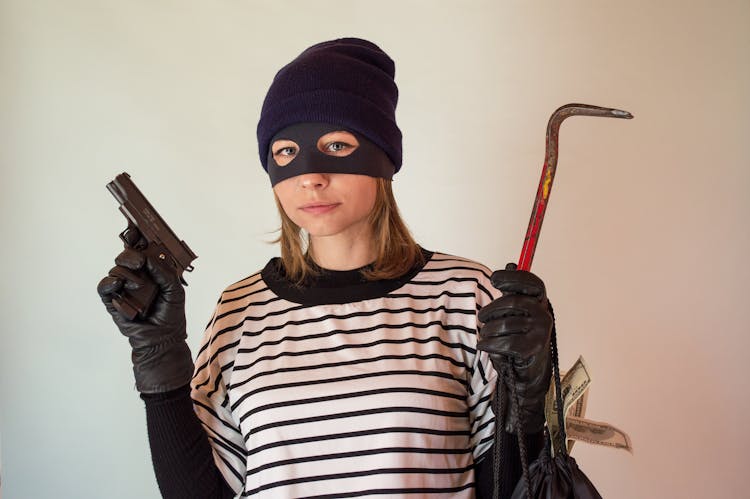 A Woman Wearing A Robber Mask