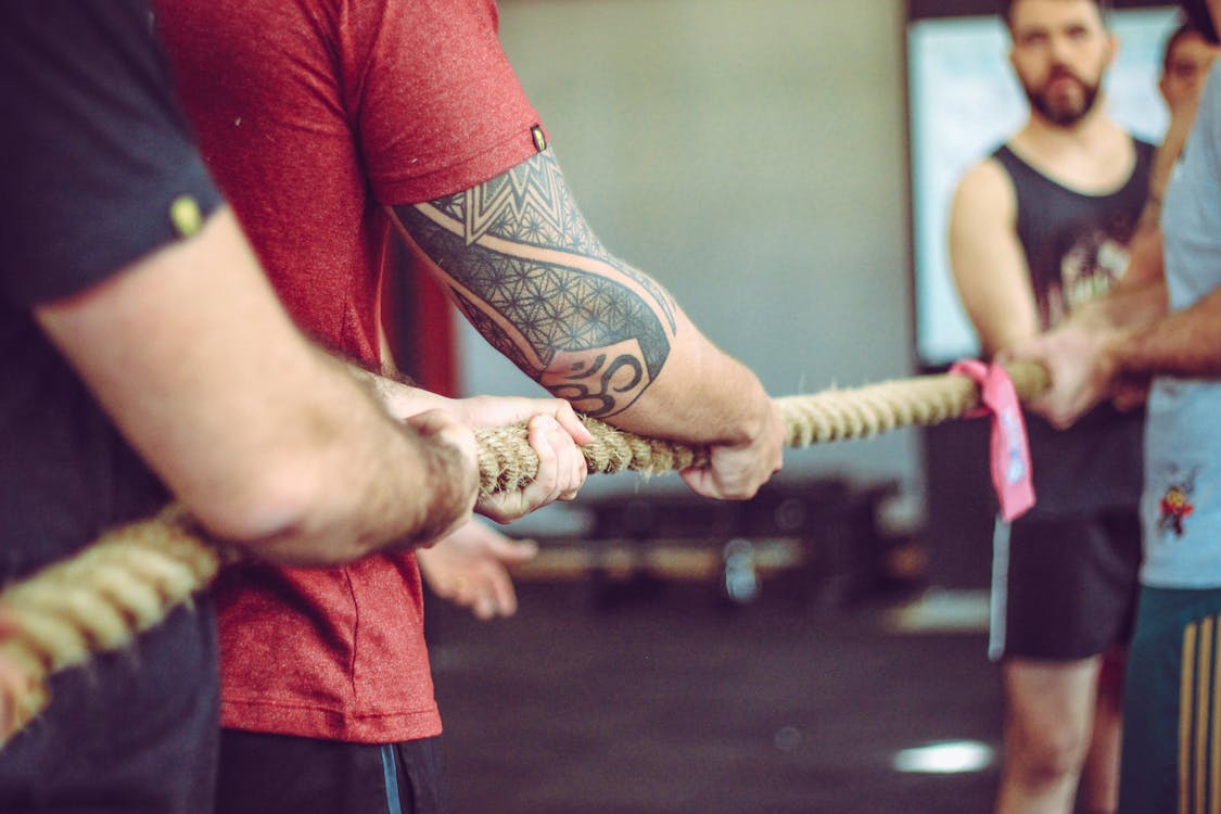 Group Of People Doing Tug Of War