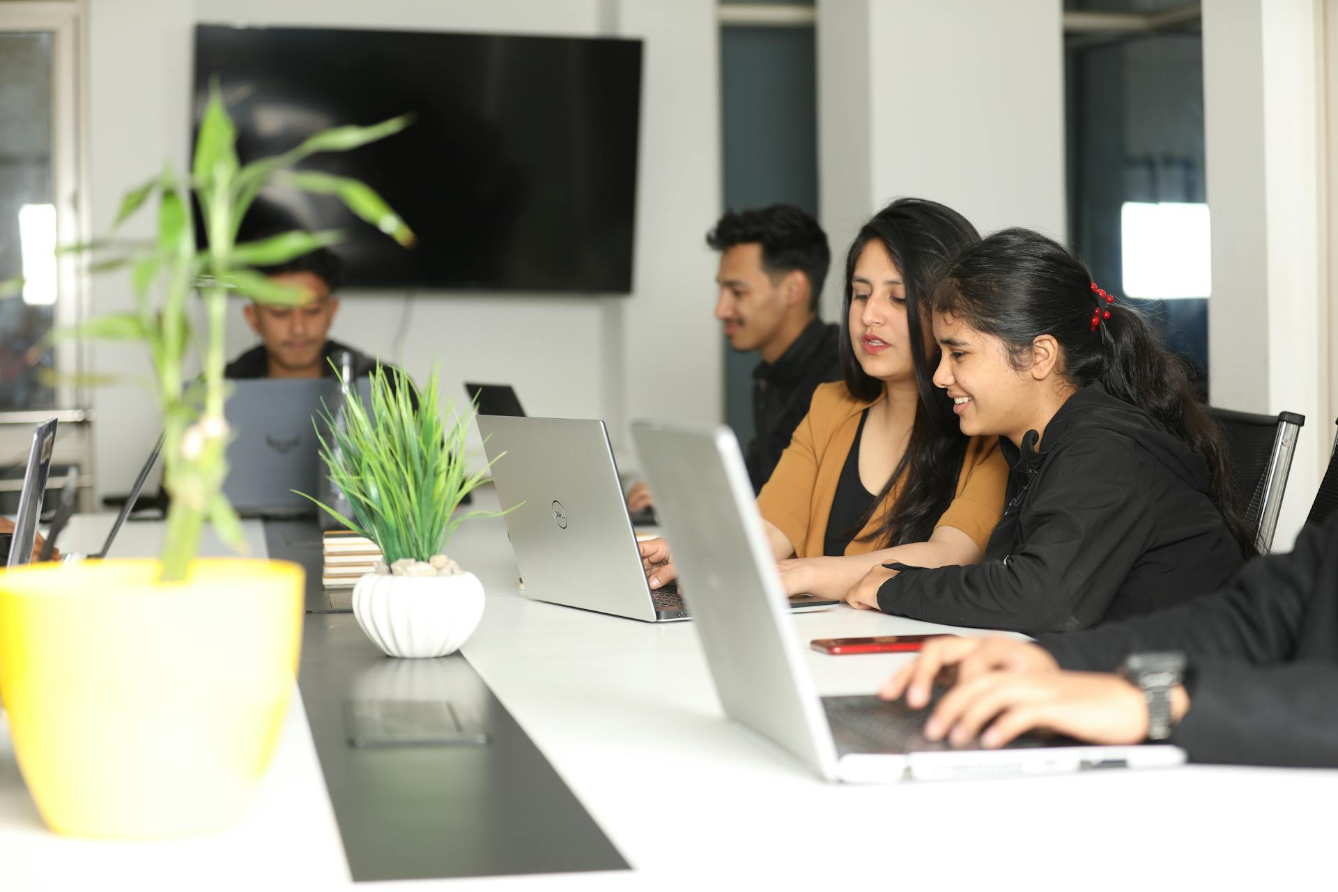 Young professionals collaborating in a modern coworking space in Kathmandu, Nepal.