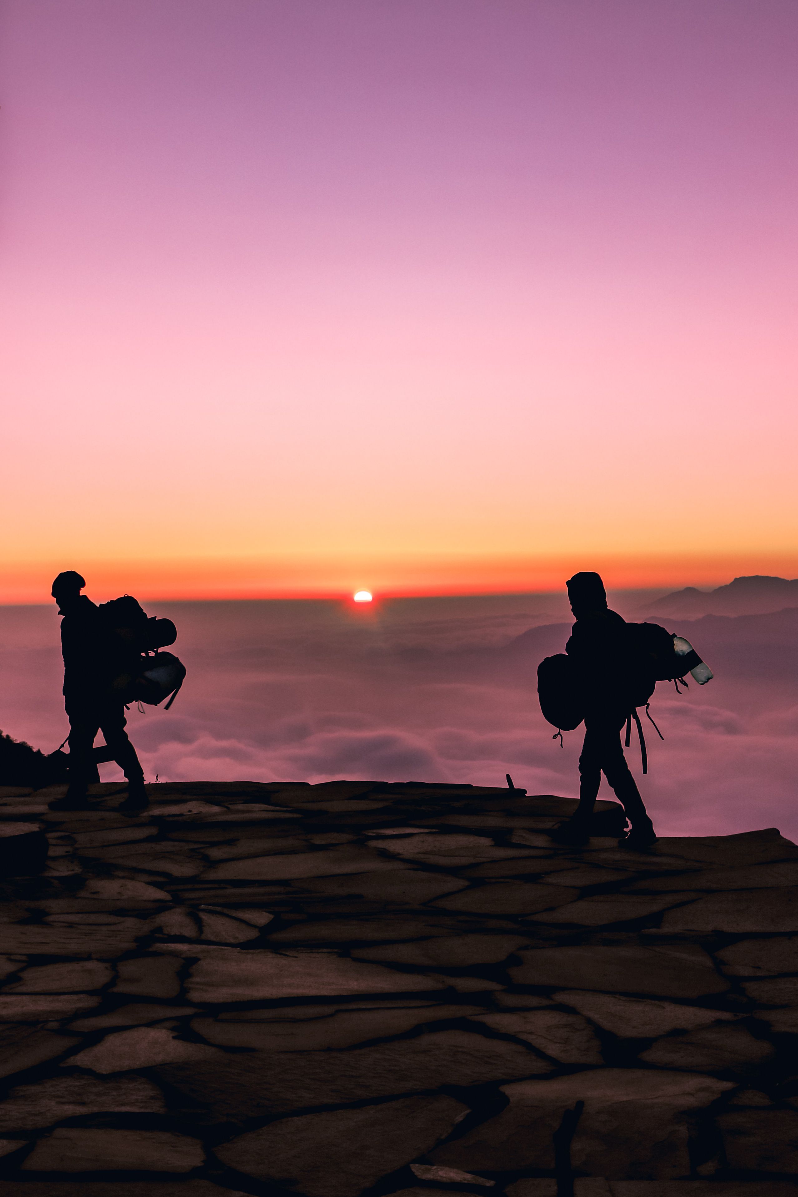 Silhouette of Two People Walking during Sunset · Free Stock Photo