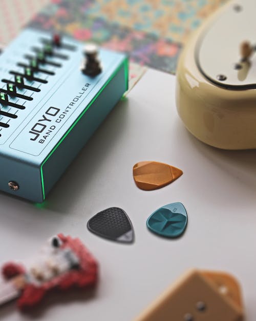 Three Guitar Picks near the Joyo Band Controller