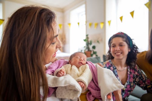 Free A Woman Carrying Her Child Stock Photo