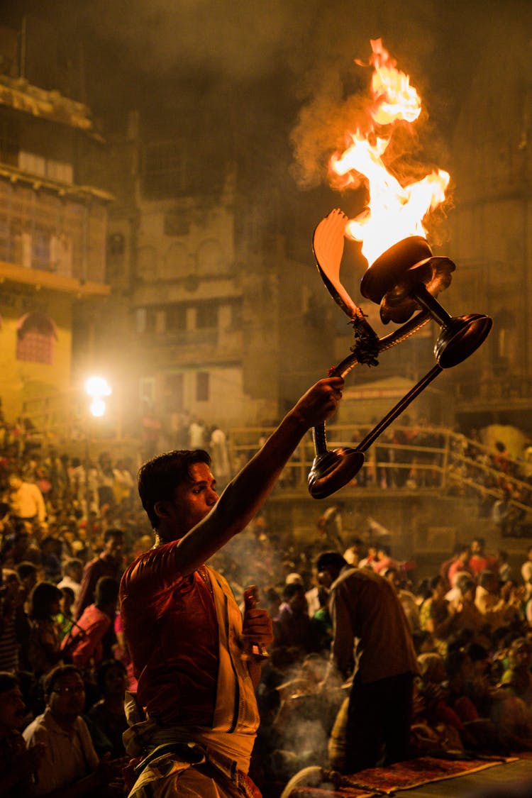 A Man Holding A Torch