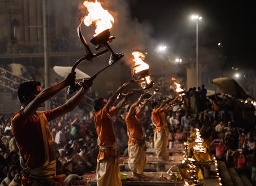 People Holding Torches