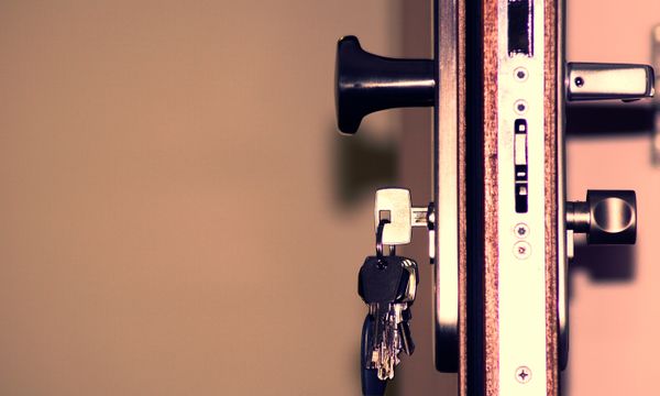 Locksmith & Door Repair โ Detailed view of a door lock and keys emphasizing security and access.