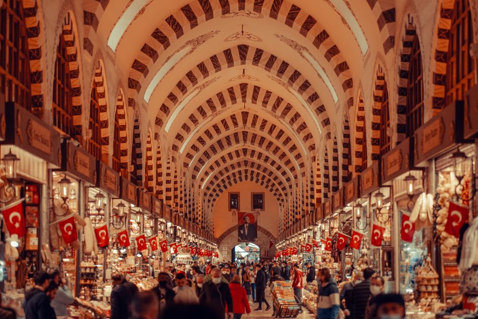 Bustling interior of the Grand Bazaar in Istanbul, Turkey, with colorful shops and goods
