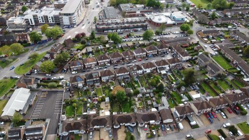 Free Aerial shot showcasing the suburban layout and residential houses in Houghton Regis, England. Stock Photo