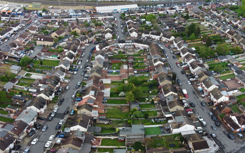 An aerial shot capturing the layout of suburban houses and streets in Luton, showcasing a residential neighborhood.