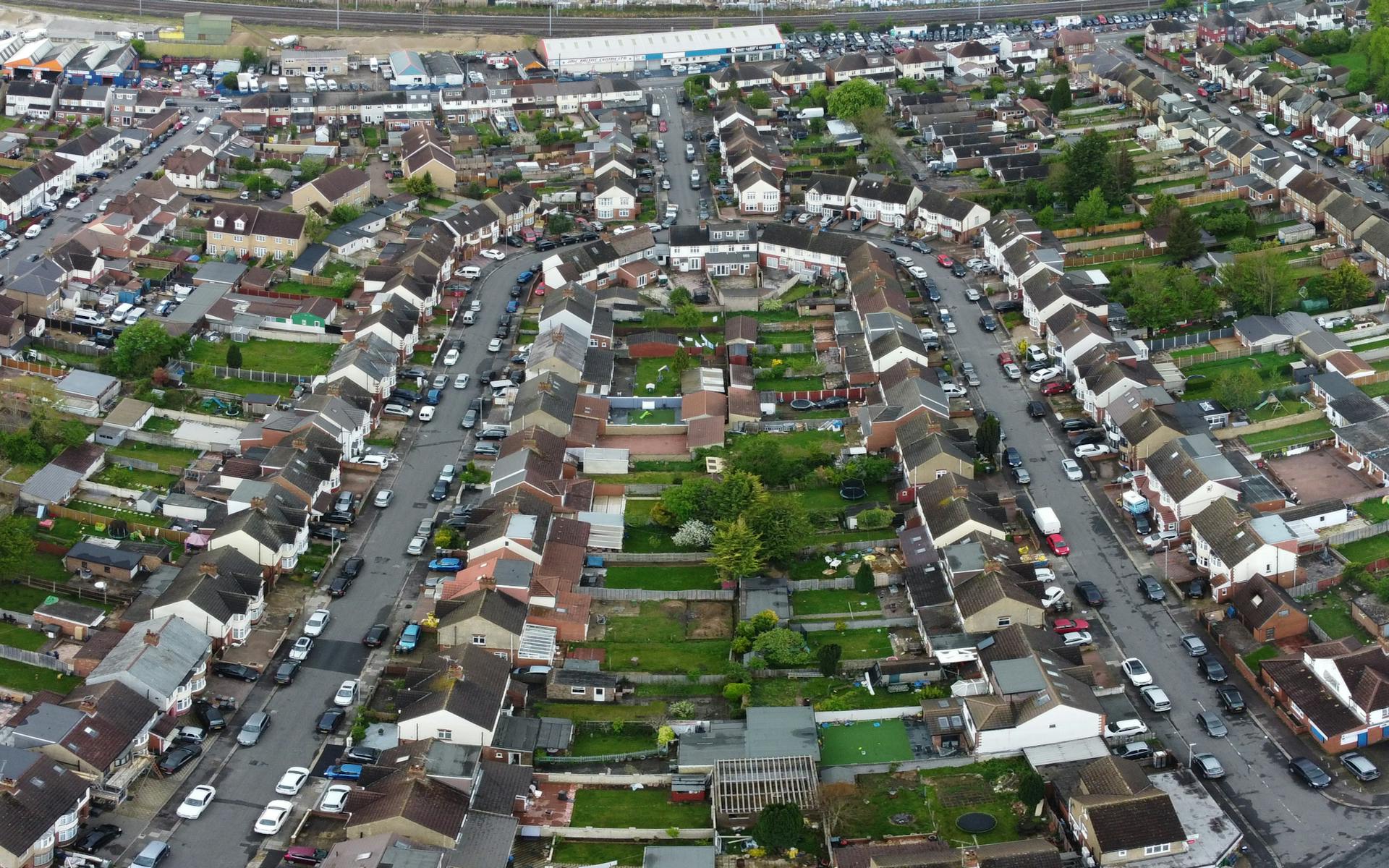 An aerial shot capturing the layout of suburban houses and streets in Luton, showcasing a residential neighborhood.