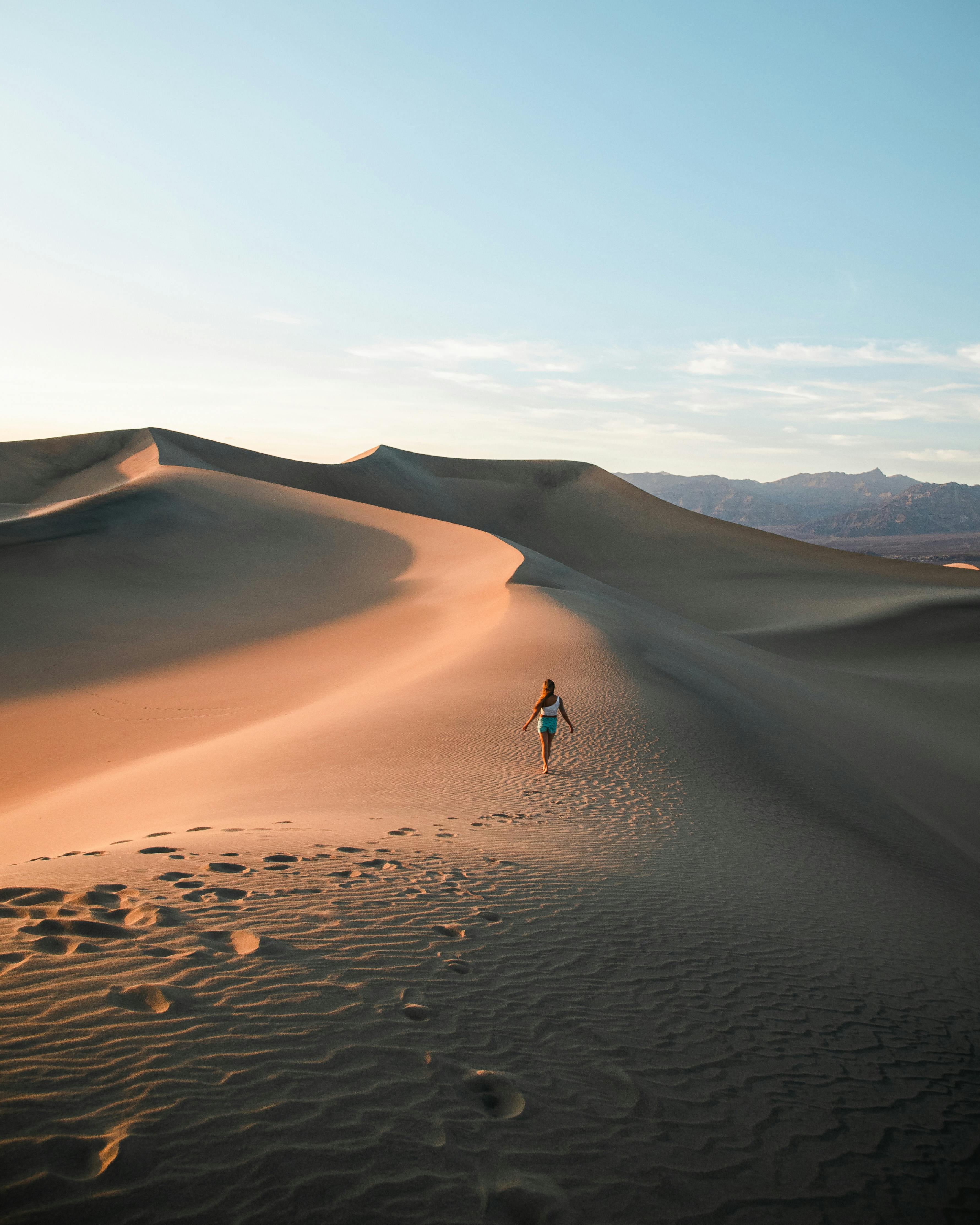 person walking on desert