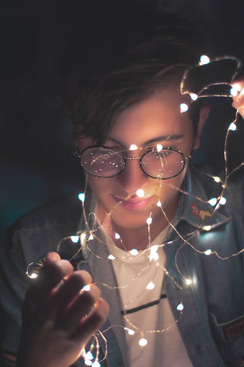 Photography of Man Wearing Eyeglasses