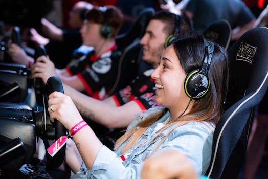A group of people enjoying an immersive gaming experience at an e-sports center with headphones and steering wheels.