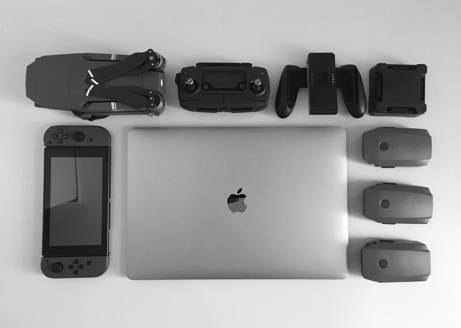 https://www.pexels.com/photo/silver-macbook-surrounding-black-electronic-devices-792345/