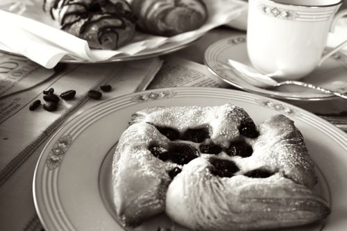 Free Black and white image of delicious breakfast pastries and coffee, creating a classic morning ambiance. Stock Photo