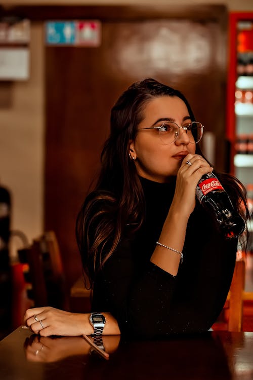 A Woman Drinking Coca Cola