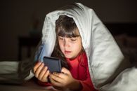 Girl in White Hoodie Holding Black Tablet Computer