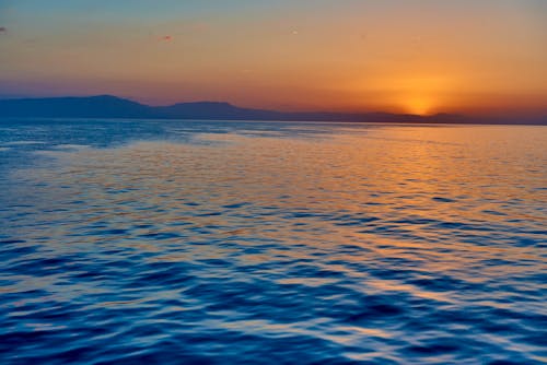 Photos gratuites de ciel clair, côte, coucher de soleil