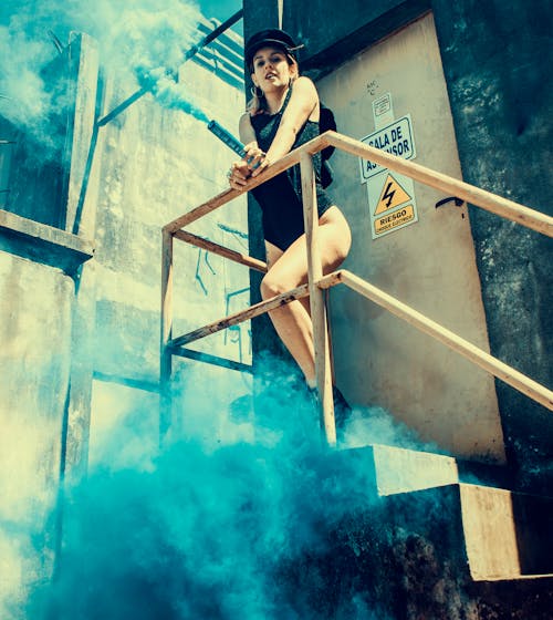 Woman in Black One Piece Swimsuit on Stairs