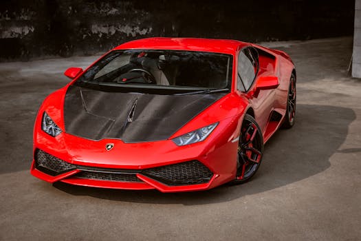 Dynamic red luxury coupe with carbon fiber hood, showcasing modern design and speed.