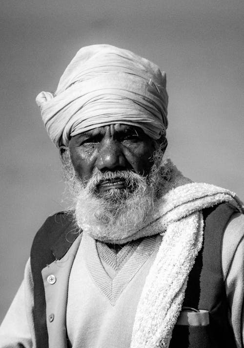 A Man in White Headscarf