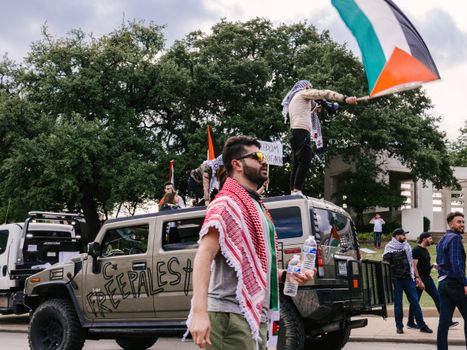 People Protesting with Palestinian Flag