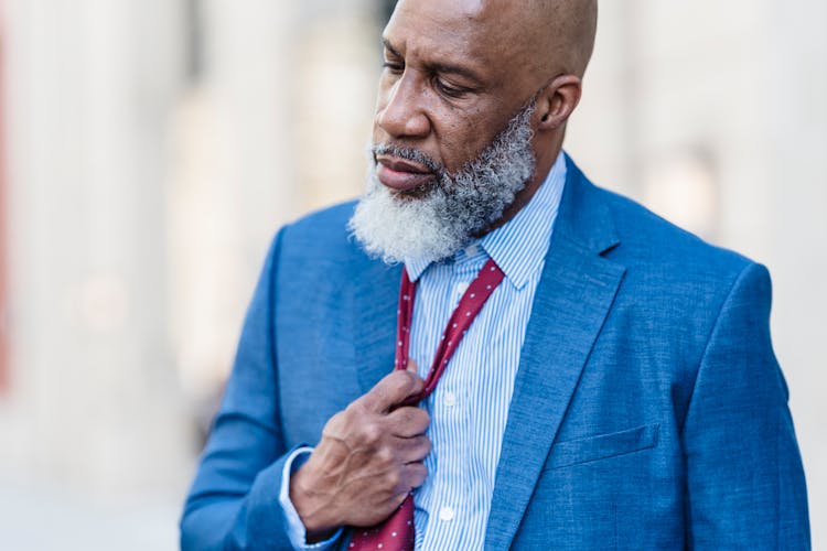 Dissatisfied Black Man In Suit