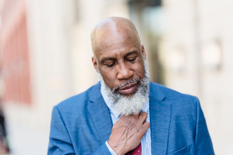 Serious Black Worker On Street