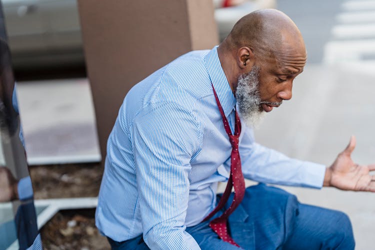 Frustrated Black Businessman On Street