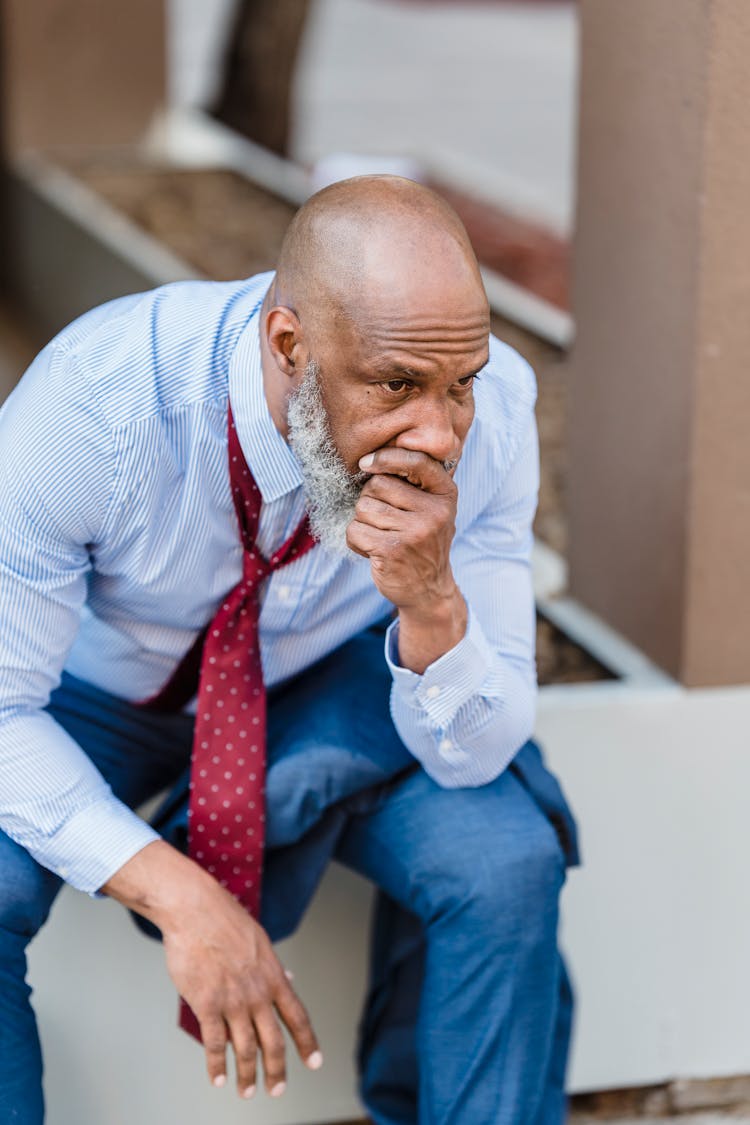 Concerned Black Businessman On Street