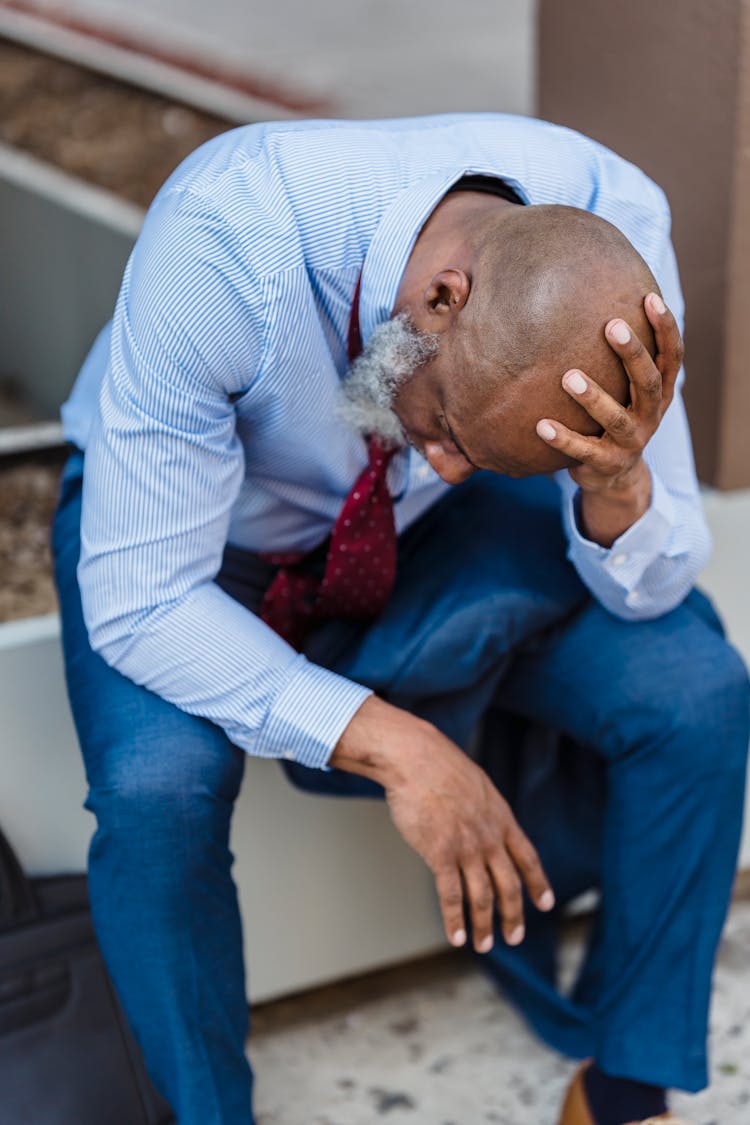 Unhappy Black Businessman In Formal Wear