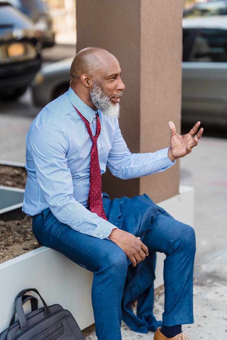 Concerned Black Businessman On Street