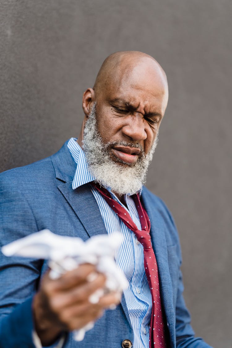 Angry Black Worker With Crumpled Document