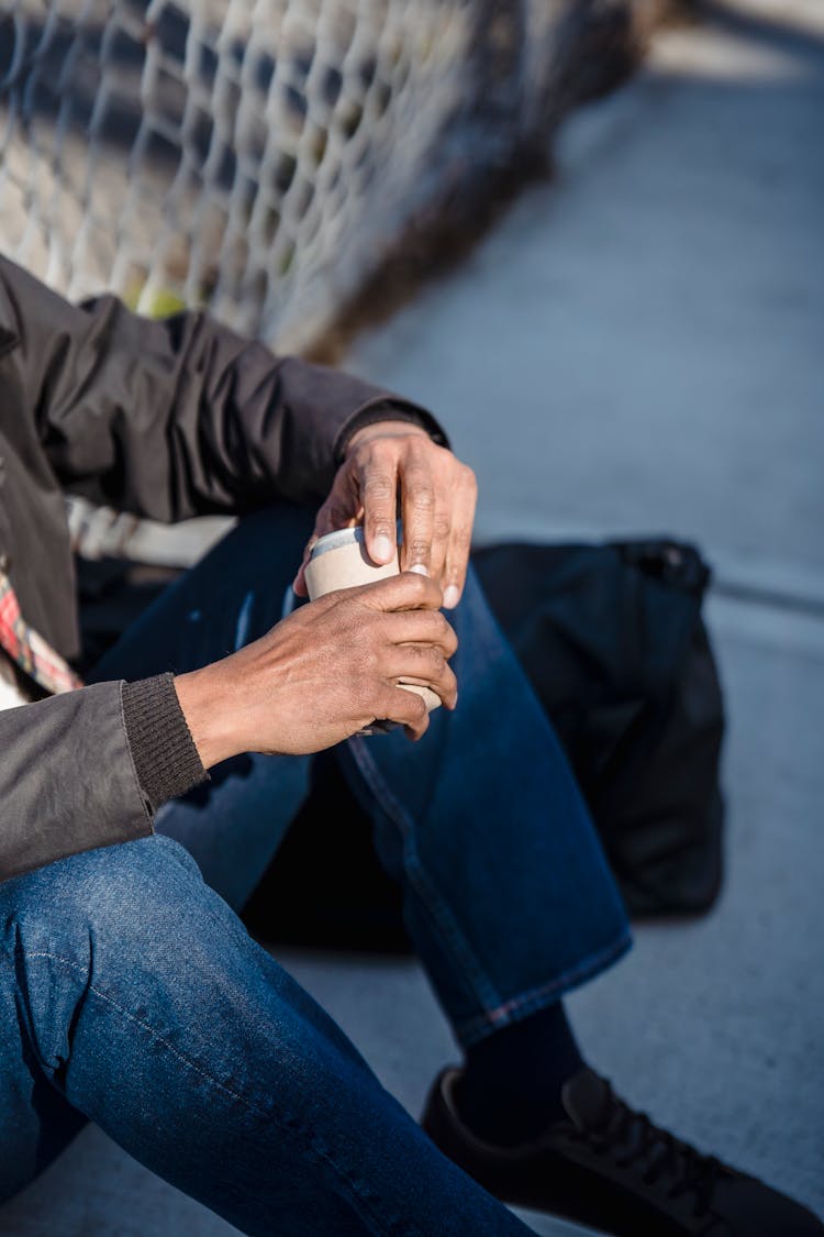 Crop Ethnic Person Opening Beer Can On Street