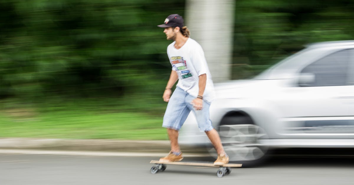 Man Playing Longboard on Road