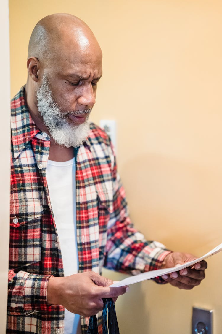 Worried Man Reading Document