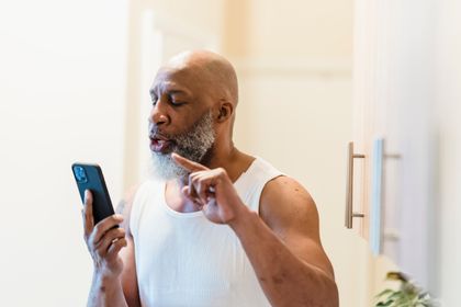 Older man using a phone