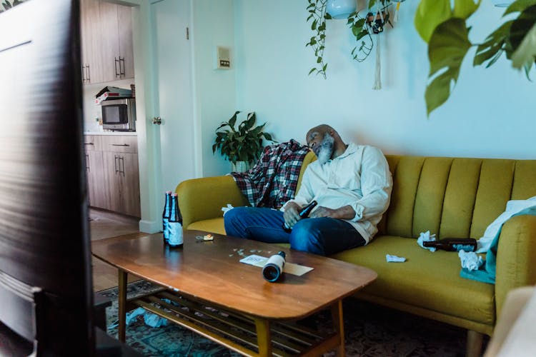 Drunken Man Sleeping On Couch