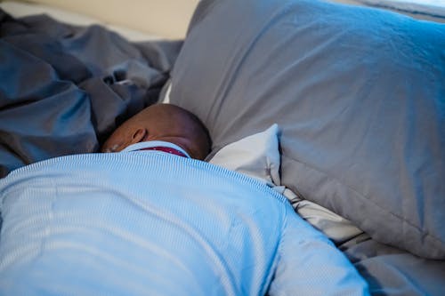 Free Photo of a Bald Man Sleeping on Bed Stock Photo