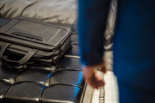 Black Leather Bag on Blue Textile