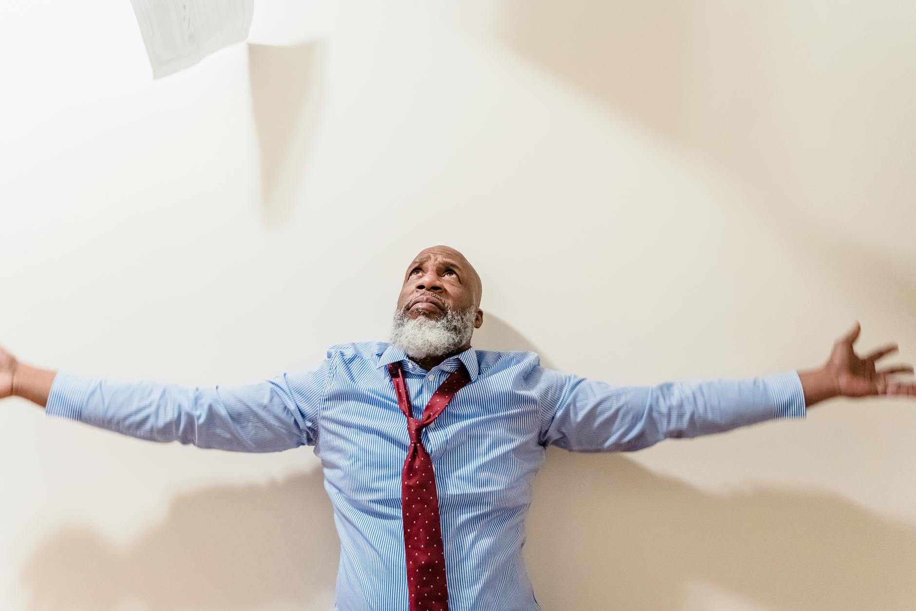 Person Looking At Signs On A Wall, Feeling Confused Or Overwhelmed