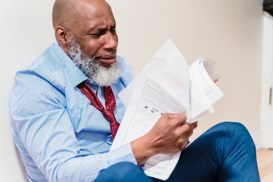 Person looking frustrated while reviewing paperwork - single wide financing Person looking frustrated while reviewing paperwork - single wide financing