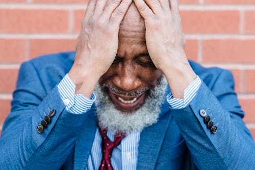 Free Stressed Man Holding His Head Stock Photo