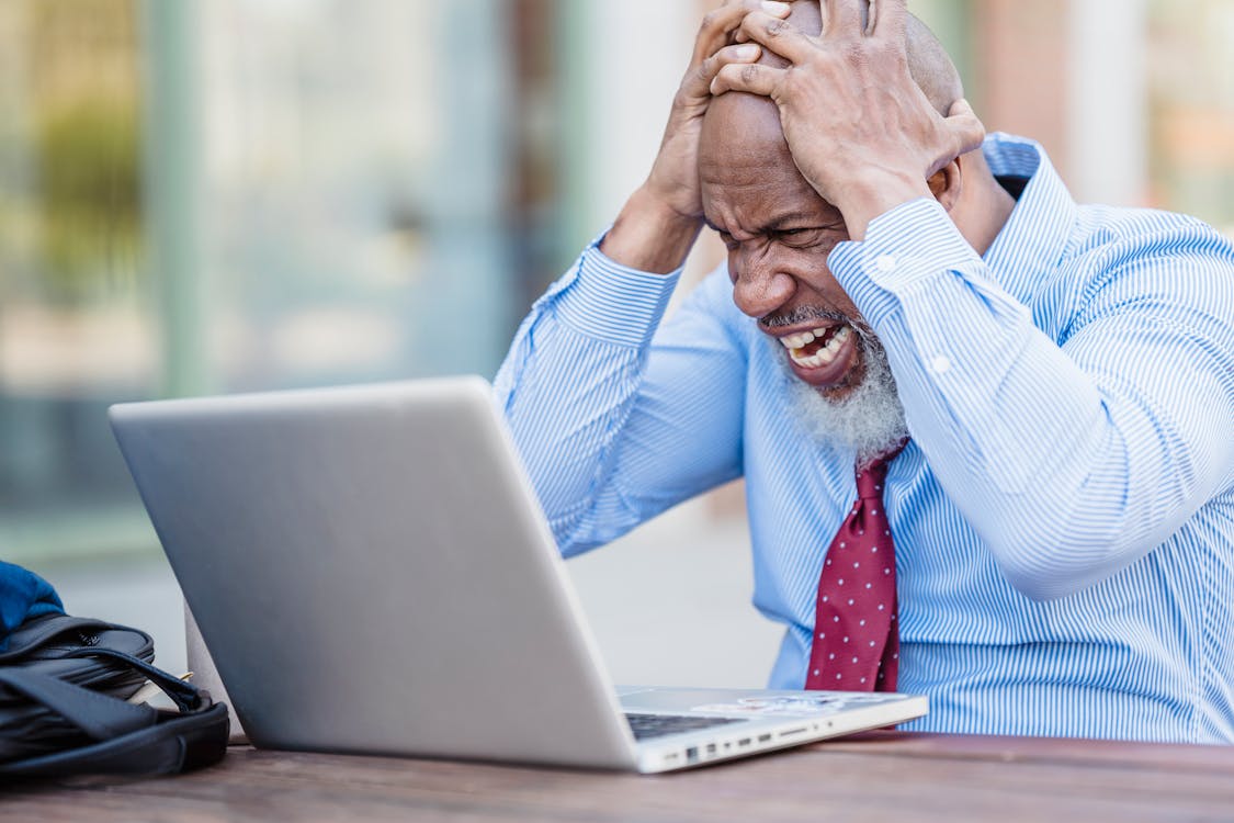 Free Frustrated Man in Front of a Laptop Stock Photo