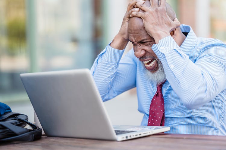 Frustrated Man In Front Of A Laptop